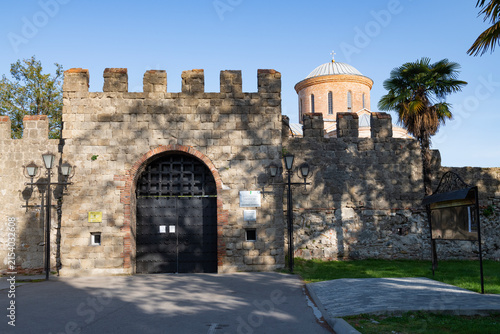 Gates of the fortress of the ancient city of Pitiunt on a sunny morning. Pitsunda, Abkhazia
