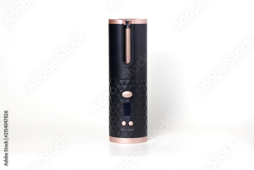 Modern cylindrical electronic device with a textured geometric body, digital display, control buttons, and sleek minimalist design isolated on a white background.