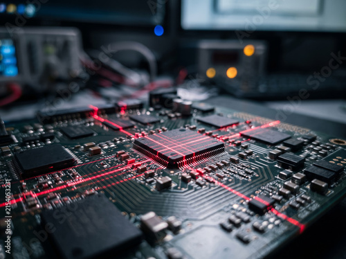 Printed Circuit Board PCB with Glowing Red CPU Processor Chip Tracks