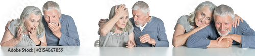 Fotografie Senior couple expressing surprise, worry and comfort while sitting together