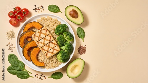Nutritious Vegan Power Bowl with Grilled Tofu Quinoa Roasted Pumpkin and Fresh Vegetables