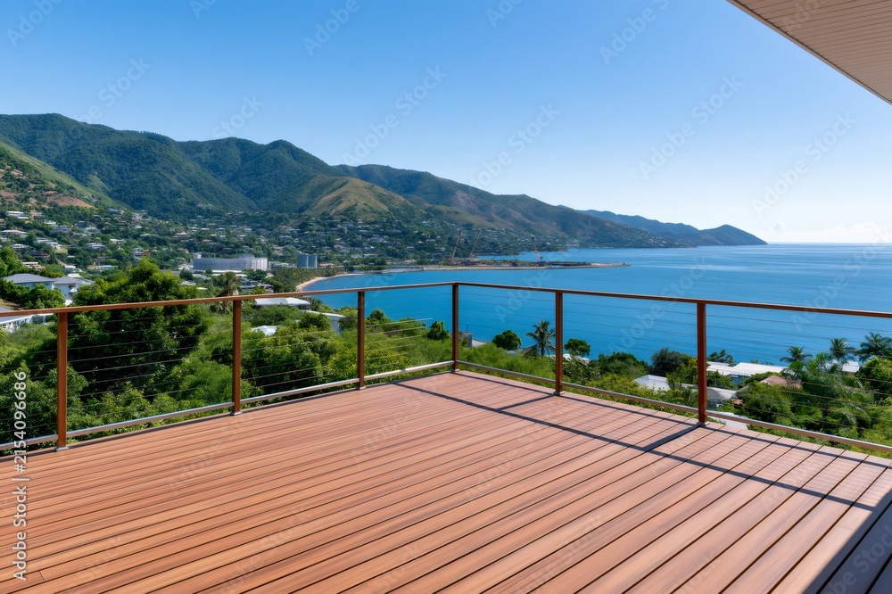 Fototapeta premium Wooden deck overlooking tropical ocean view mountains