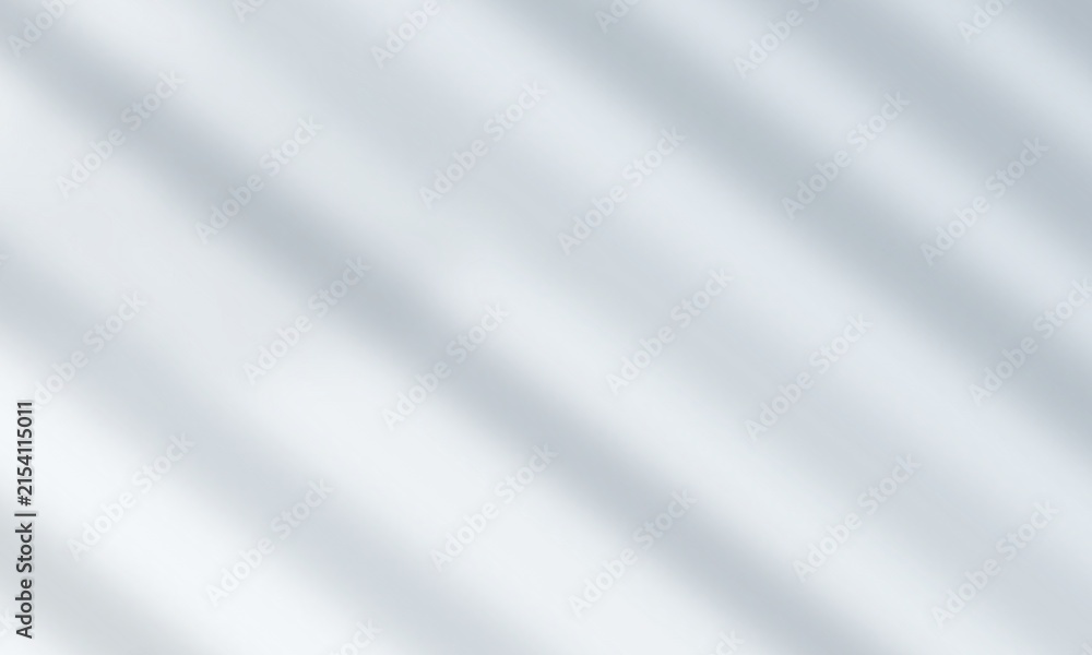 Fototapeta premium Soft diagonal light shadows cast on a smooth light grey surface for modern background