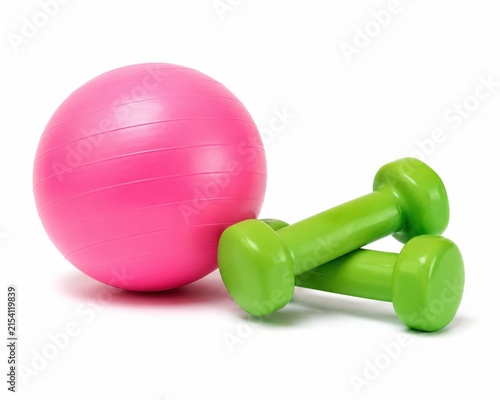 Pink fitness ball and two green dumbbells for exercise and workout