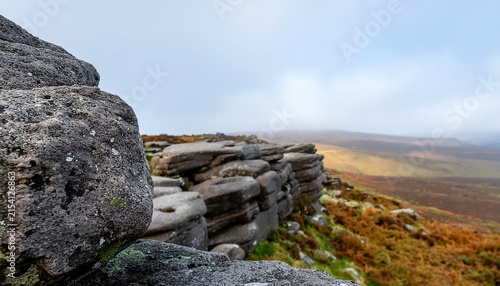 Dramatic coastal cliff landscape at sunset with rugged rocks.