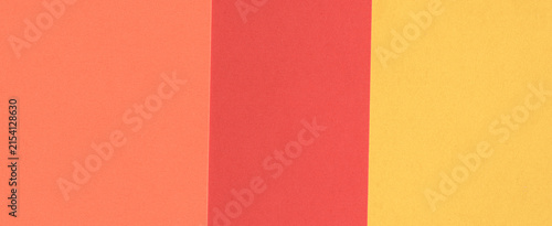 Colorful paper texture with orange, red and yellow tones in panoramic format