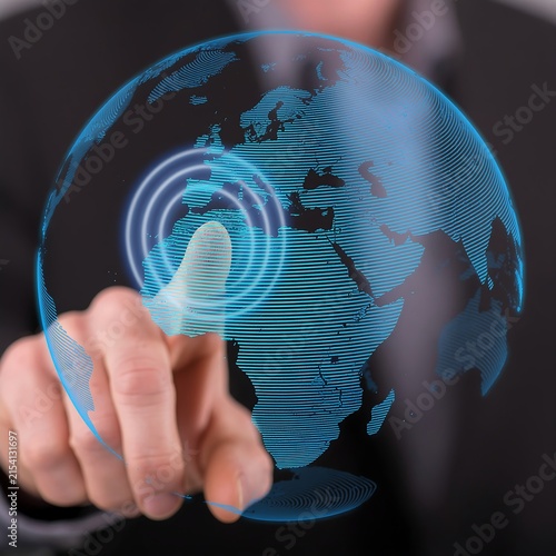 Person holding glowing digital globe with data streams.