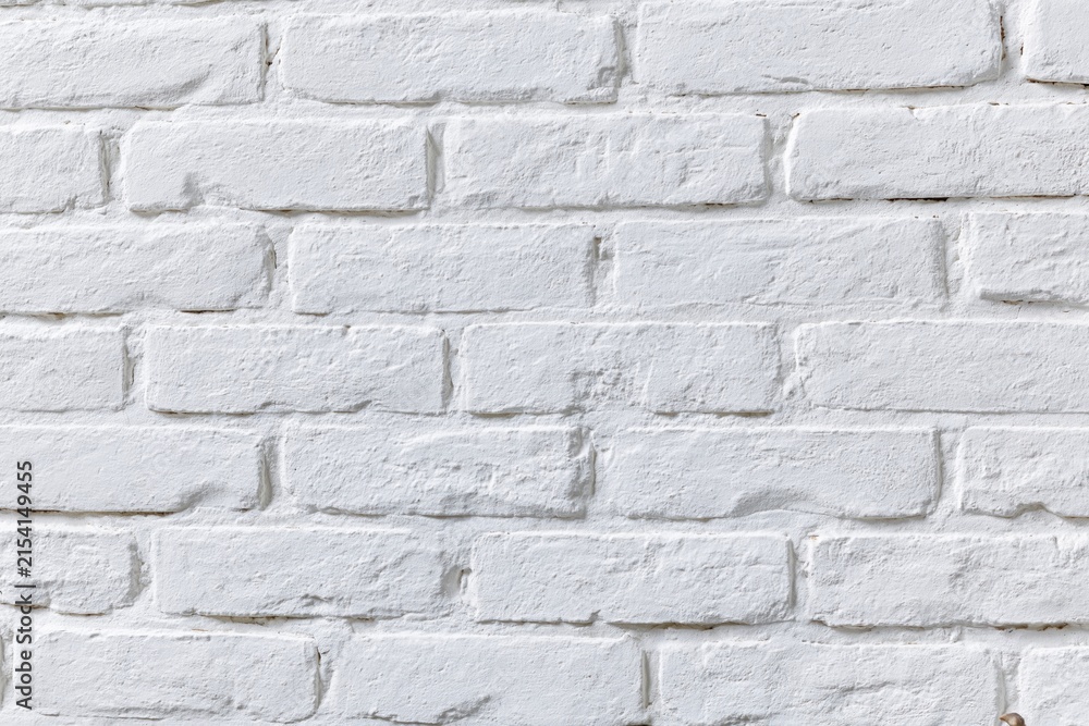 Fototapeta premium The White Brick Wall as a Clean Textured Background for Modern Design