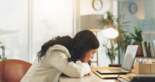 Business, woman and tired with laptop in office for editing burnout, info overload and first job. Intern editor, bored and low energy at tech from mental fatigue, workload or tedious source research