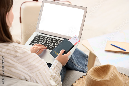 Woman booking travel online...