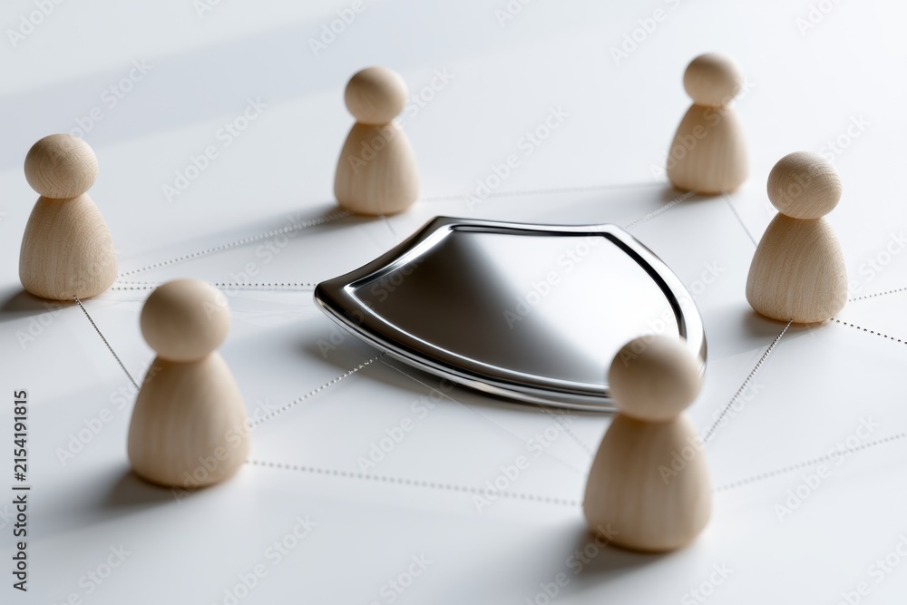 Obraz premium Wooden figurines connected by dotted lines encircling a reflective metallic shield symbolizing collaborative protection and network security concepts
