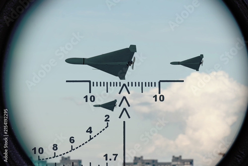 Принти на полотні Three military drones in targeting scope against cloudy sky,