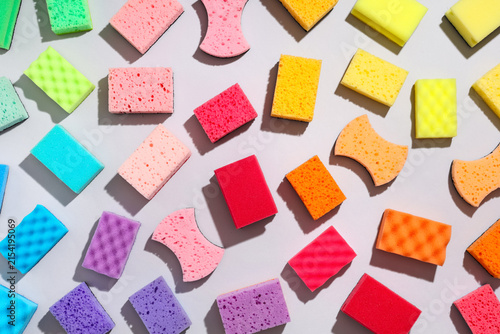 Quadro su tela Colorful cleaning sponges and kitchen scourers in various shapes and sizes on a
