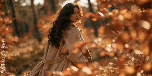 modern woman walking through autumn forest, stylish woman enjoying autumn nature, contemporary female portrait in colorful autumn forest
