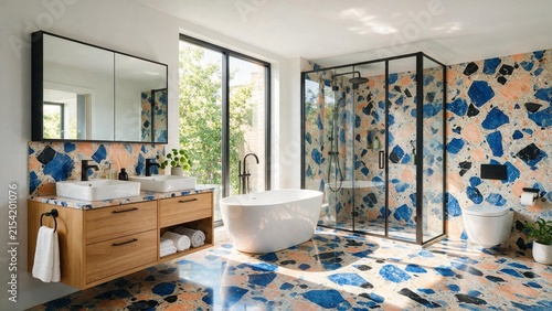 Modern bathroom interior featuring vibrant blue and pink terrazzo tiles with freestanding bathtub with contemporary bathroom characterized showcases bright contemporary