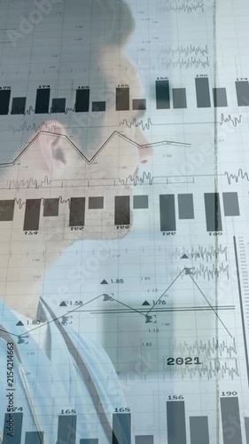 Analyzing data charts and graphs, medical professional working in office