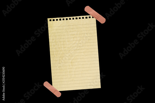 Принти на полотні Piece of notebook paper patched with a torn bandage, isolated black JPEG