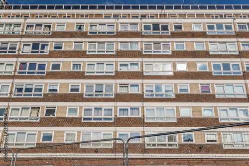 Canvas Print Council apartment block facade with temporary fencing in the foreground on the Y