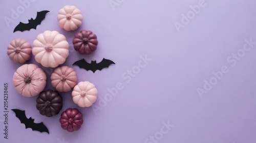 Miniature decorative pumpkins in various shades of purple corner