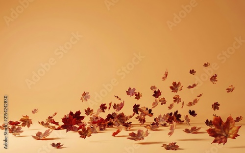 A collection of colorful autumn maple leaves floating and falling through the air against a solid warm beige background, creating a dynamic and seasonal composition of fall foliage