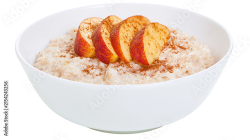 Canvas Print Creamy oatmeal topped with sliced red apples and cinnamon, isolated on transpare