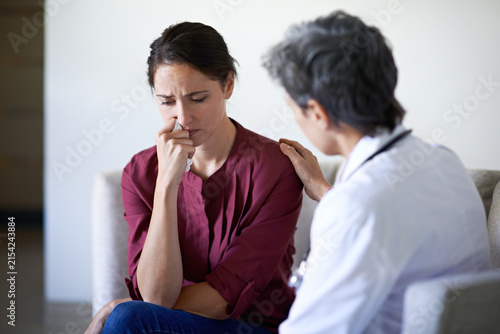 Konstfotografi Crying, woman and doctor support in waiting room for bad news, terminal prognosis and empathy