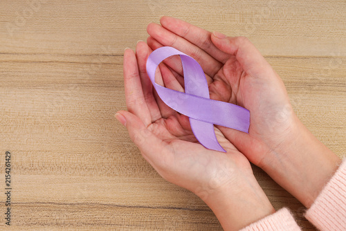 Top View of Purple Awareness Ribbon in Both Palms