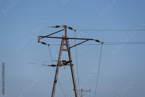 ENERGETICS - Medium voltage line over green pastures and meadows