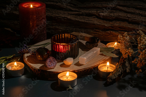 Photography Mystical witchcraft altar with a burning tealight candle surrounded by lavender,