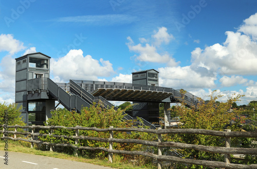 Pedestrian bridge with elevator over railway tracks