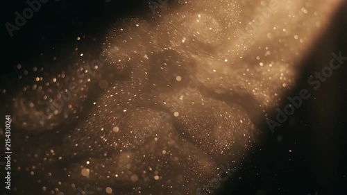 Golden dust particles in light beam 4K Video