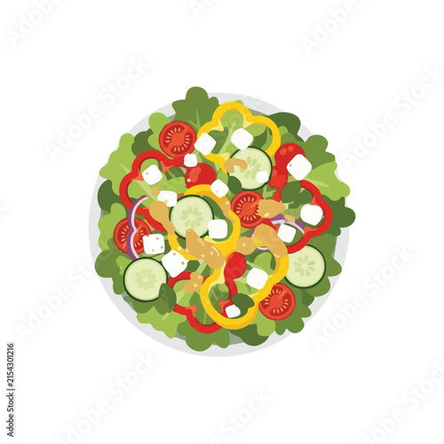 Top view of a fresh healthy mixed salad with vegetables and feta cheese in a bowl.