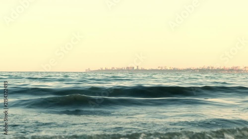 Small sea waves in the evening, clear horizon