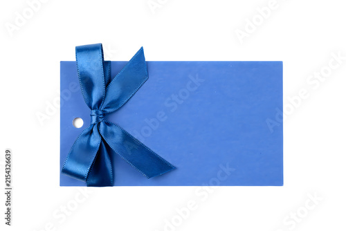 Elegant blue gift tag with a satin ribbon bow on a dark background for celebratory occasions and special events