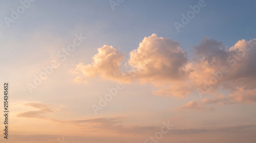 Canvastavla A picturesque photograph capturing fluffy cumulus clouds illuminated by the soft
