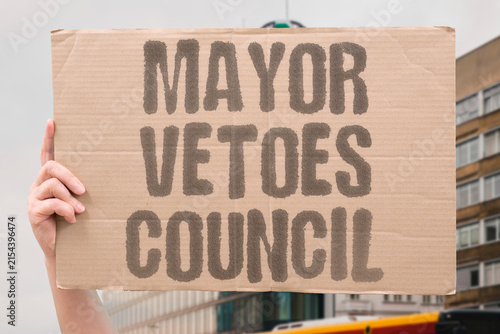Fotografía "Mayor Vetoes Council" A mayor uses veto power to block a city council decision