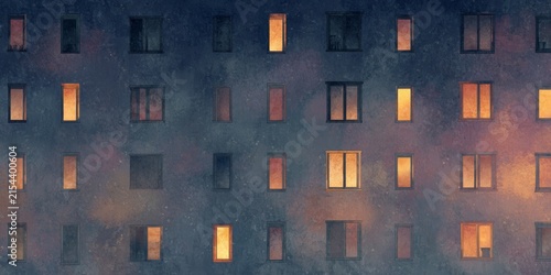 Dark apartment building facade at night with illuminated warm windows