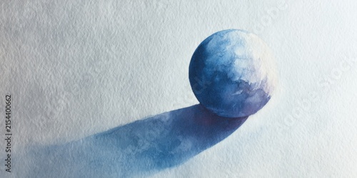 Blue watercolor sphere casting a long dramatic shadow on textured paper