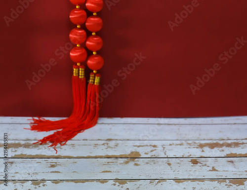 Photography Traditional Chinese New Year red background with lucky Chinese knot tassels and