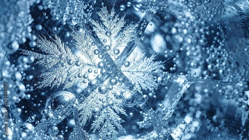 Bubbles rising in clear ice with intricate frost patterns illuminated by light, showcasing the dynamic interaction of air and water in a close-up view
