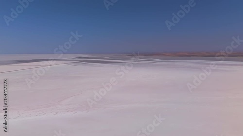 Aksaray, Turkey. Tuz Golu, one of the world's largest hypersaline lakes, endless white mineral flats stretching to the horizon under a clear summer sky, wide aerial panorama. Aerial View