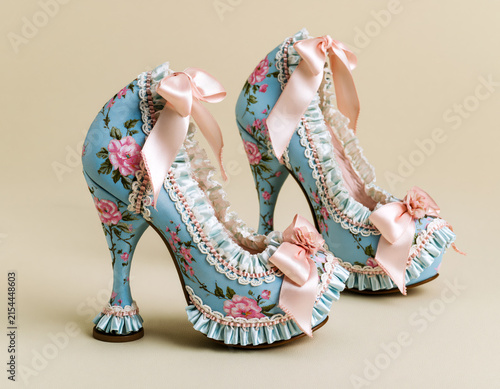Blue floral rococo heels with pink rose print lace ruffle trim and satin bows.