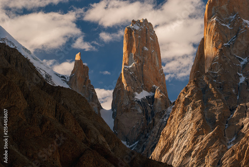 View of the Nameless Tower of Trango Group rising above snow-covered slopes in the Karakoram Range, Gilgit Baltistan, Pakistan.