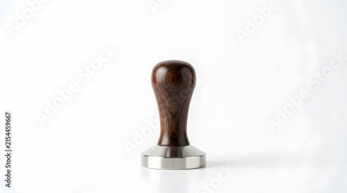 Coffee tamper standing upright on white background