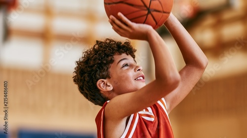 Young Boy Preparing to Shoot Basketball