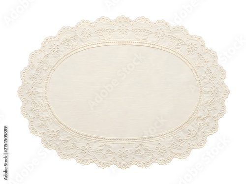 Elegant oval lace doily mat for vintage style table setting.