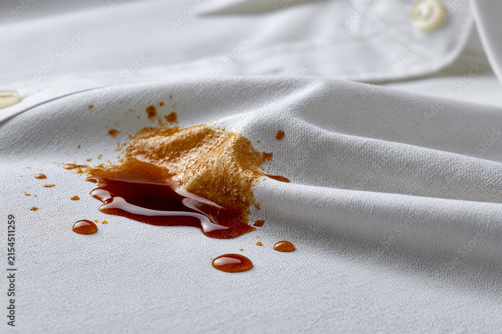 Obraz premium Bright white shirt with stains on a surface