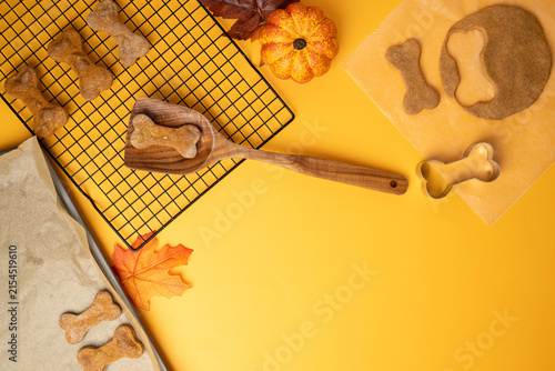 Quadro su tela Crunchy baked healthy dog treat, bone shaped biscuits on a wire cooling rack pum