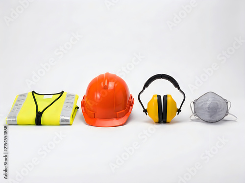 Personal protective equipment ppe including a highvisibility vest, hard hat, ear defenders, and a dust mask, arranged in a row, isolated on white background