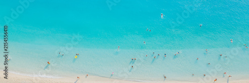 Photography Aerial top view of tourists swimming and sunbathing in turquoise sea water near